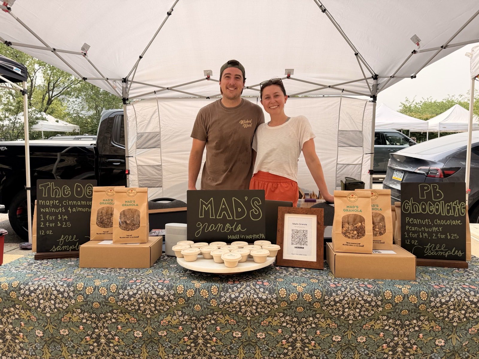 Eric and Madison behind their table at their first farmers market