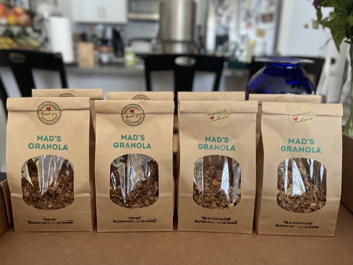Four bags of Mad's Granola in a row, two of The OG and two of PB and Chocolate